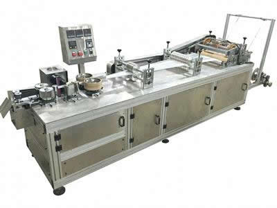 Plastic strip cap machine