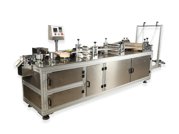 Non woven strip cap machine